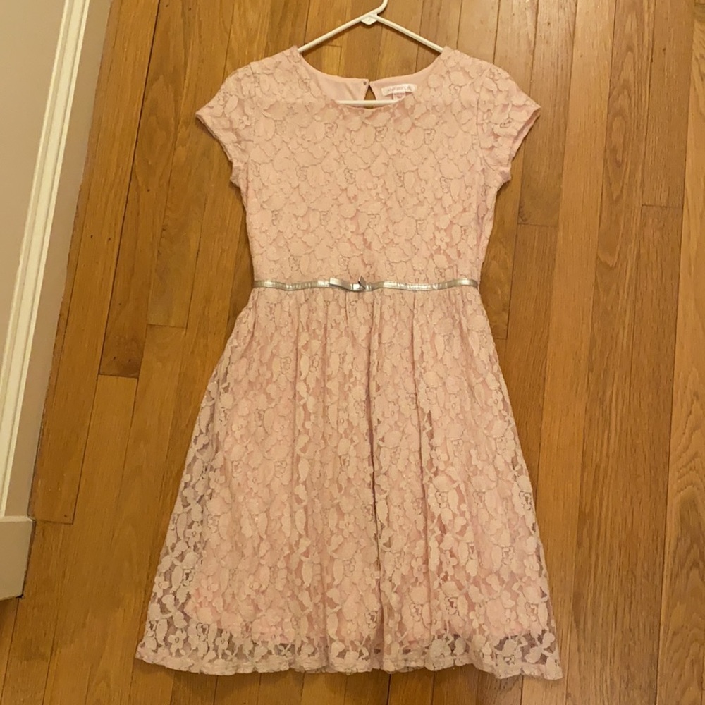 Pink teenage girl dress with a silver bow around the waist.